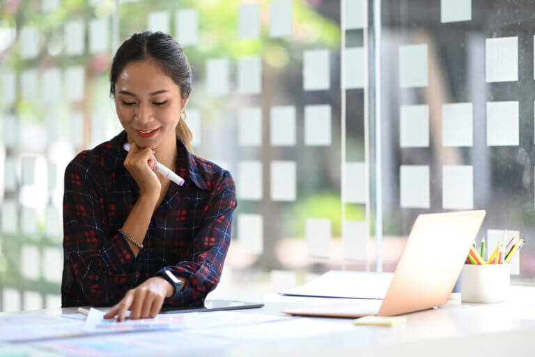 Female employee planning development in creative office