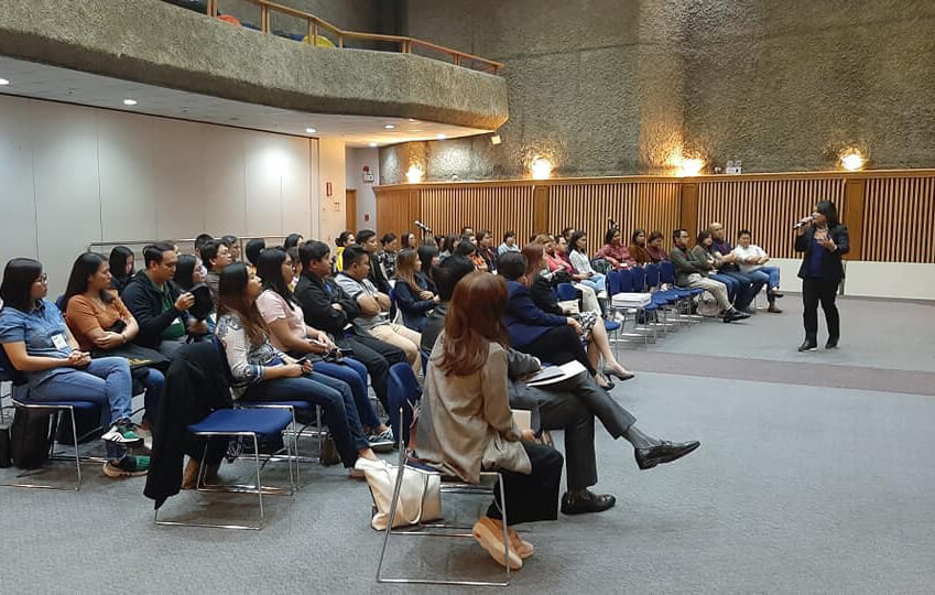 A female executive giving best career tips to an audience.