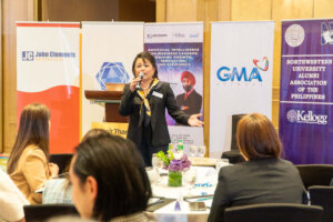 female speaker talking to audience 