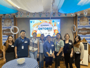 people posing for a photo in a festive room