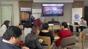 speakers presenting to a small audience