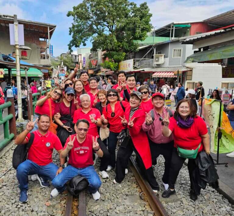 a group of people in red shirts