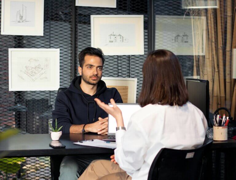 woman interviewing man