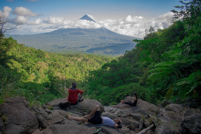 people sitting on rock formation