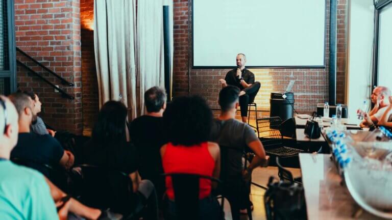 Man Sitting In Front of Audience