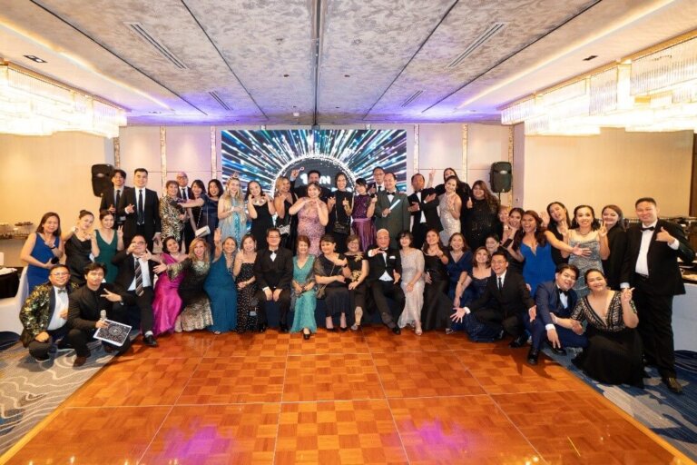 attendees pose for a group photo at AI-themed Cady Awards night