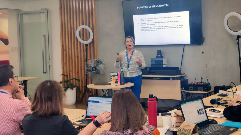 female speaker facilitating a session on demystifying ai