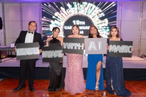 Performers of Outsourcing Division holding placards that read "Transforming Dreams with AI Magic"