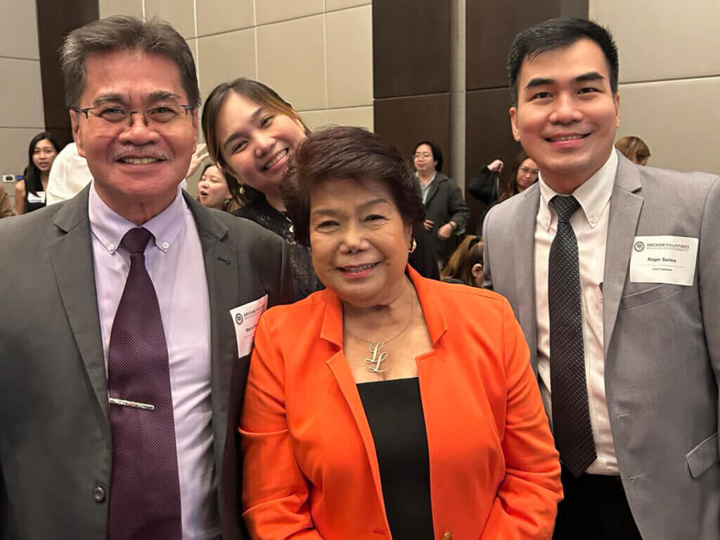 two men and a woman posing for a picture with the female speaker for a session on effective leadership