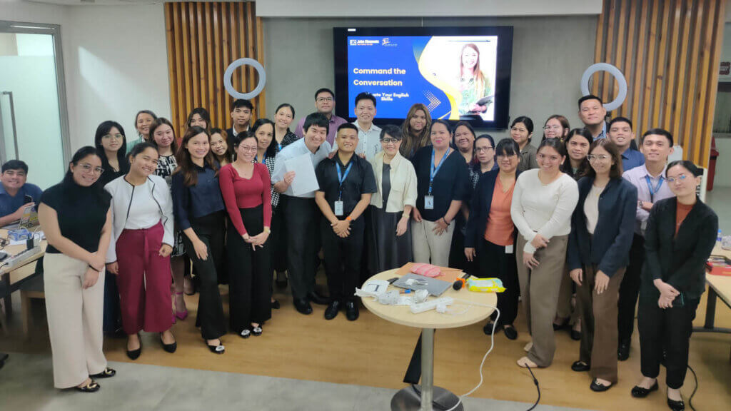 Participants of the English grammar workshop, led by Angeline La Viña, posing after a successful session on improving language skills.