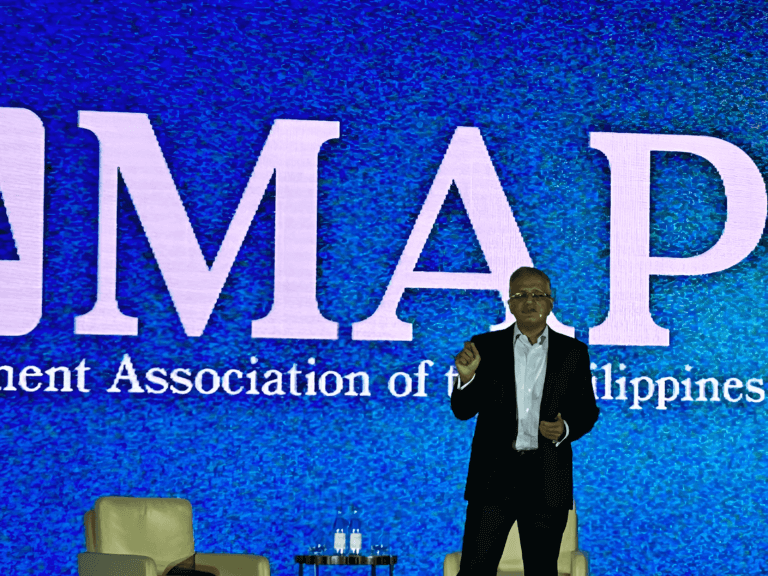 Sandeep Uppal, President and CEO of HSBC Philippines, delivering a session on 'Leading Through Change' at the MAP International CEO Conference 2024, with the Management Association of the Philippines (MAP) logo displayed prominently in the background.