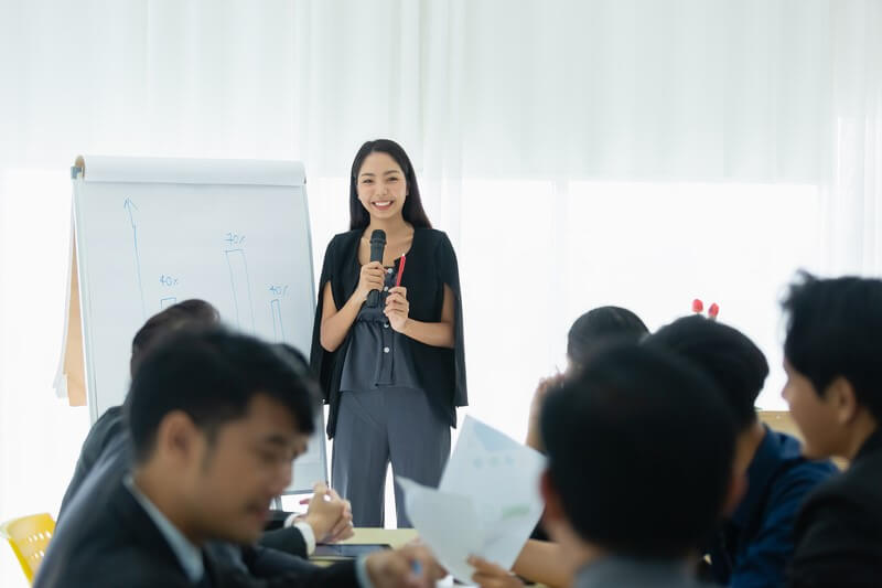 Facilitator presenting innovative leadership development strategies to a group during a professional workshop.