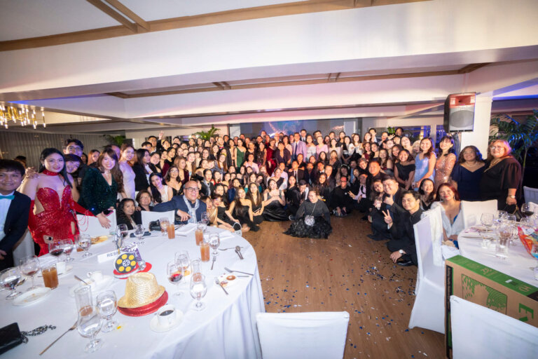 Group photo of guests during the Hollywood glam Christmas party.