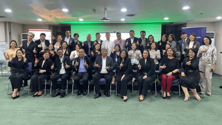 A group of professionals from John Clements Leadership Institute and Landbank pose together at the Leadership Reimagined Program graduation, celebrating their achievements in corporate leadership training.