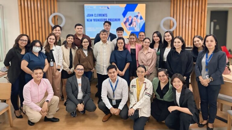 Group photo of participants at the John Clements New Managers Program, highlighting the importance of effective delegation in leadership development.