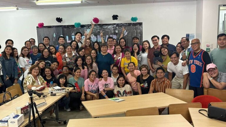 A diverse group of professionals in a casual office setting celebrating career milestones, representing nontraditional career paths in the Philippines.