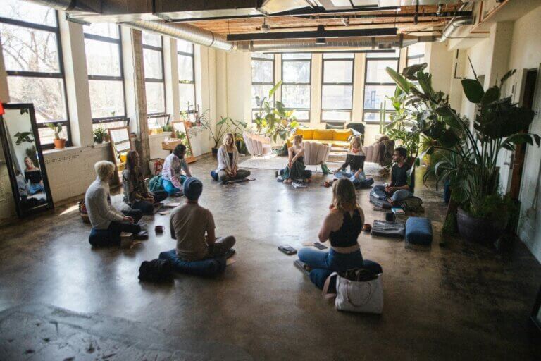 Employees participating in a guided meditation session