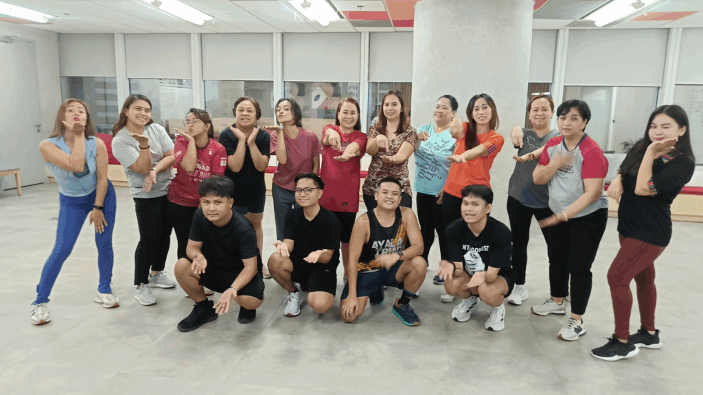 Employees dancing Zumba for wellness at John Clements