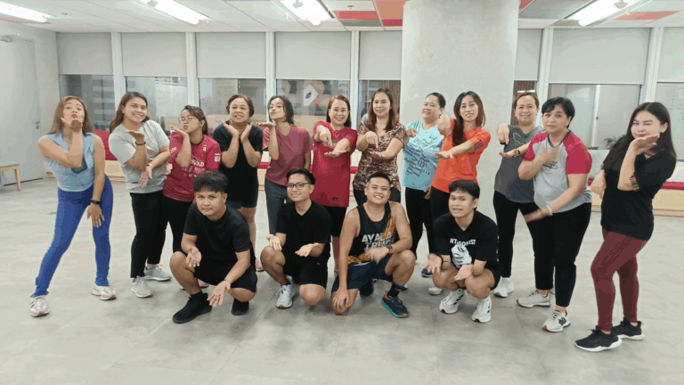 Employees dancing Zumba for wellness at John Clements