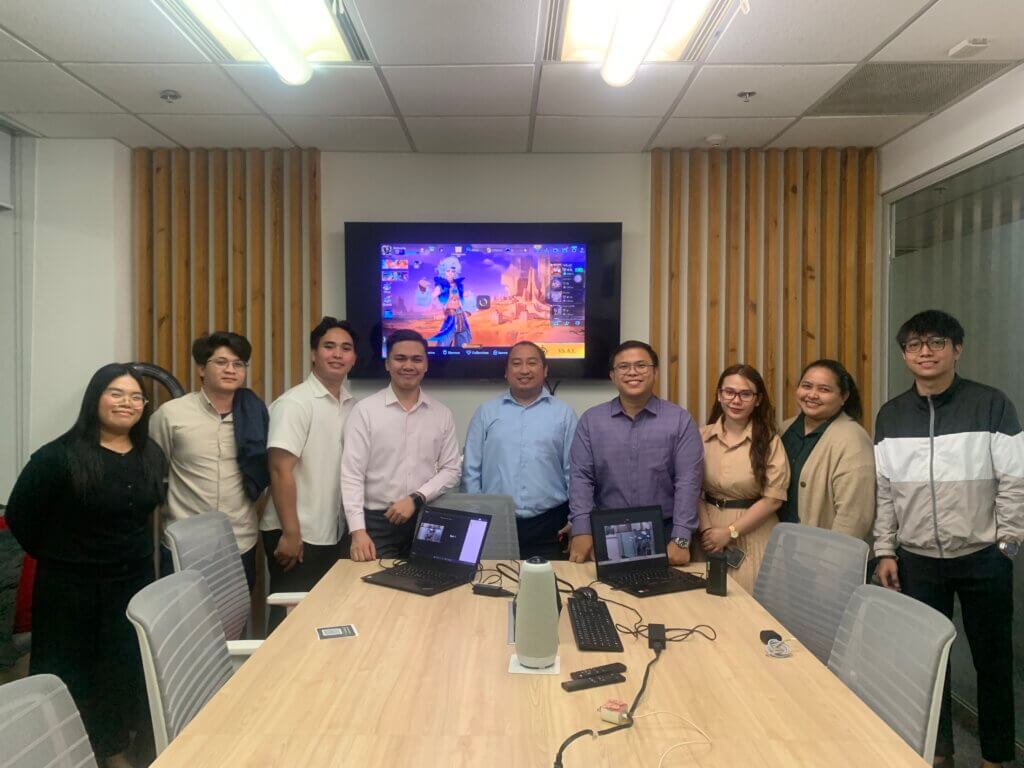 Employees playing Mobile Legends during a workplace engagement tournament
