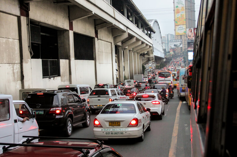 Metro Manila traffic crisis showing congested roads and commuters