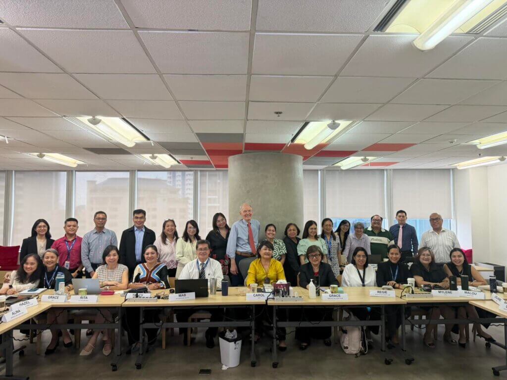 Employees participating in a coaching refresher session focused on workplace coaching and leadership development