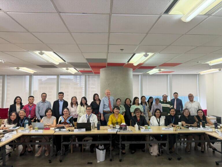 Employees participating in a coaching refresher session focused on workplace coaching and leadership development