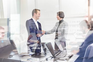 http://www.dreamstime.com/stock-photos-business-people-shaking-hands-moder-corporate-office-sealing-deal-finishing-up-meeting-businessmen-working-laptop-seen-image91983413